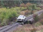 Hyrail running ahead of the excursion train to look out for rockslides on this rainy day